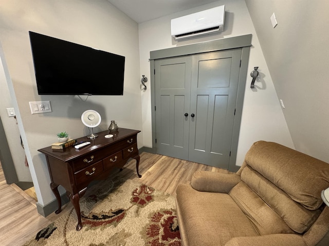 51 Yosemite Dr, Cherokee Village, AR 72529 - living area with a wall mounted air conditioner and light wood-style flooring