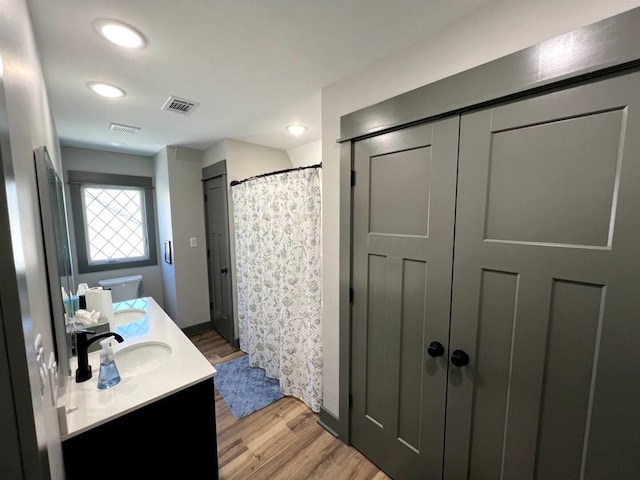 51 Yosemite Dr, Cherokee Village, AR 72529 - bathroom with wood finished floors, double vanity, recessed lighting, and a shower with curtain