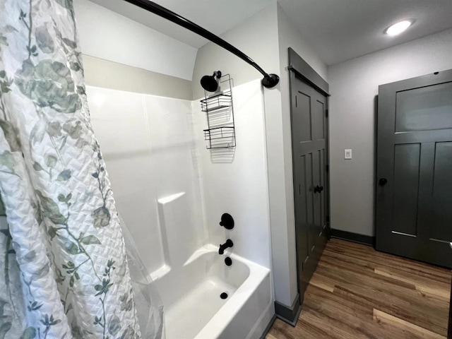 51 Yosemite Dr, Cherokee Village, AR 72529 - full bathroom with shower / bathtub combination with curtain, wood finished floors, and baseboards