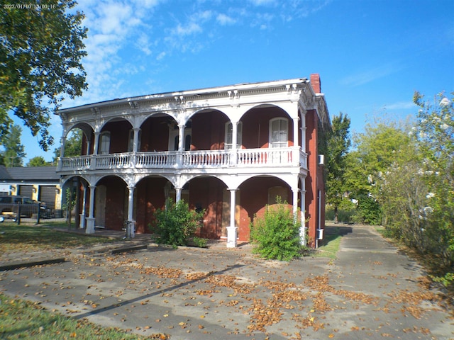 italianate home with a balcony