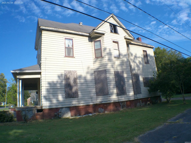 view of home's exterior featuring a yard