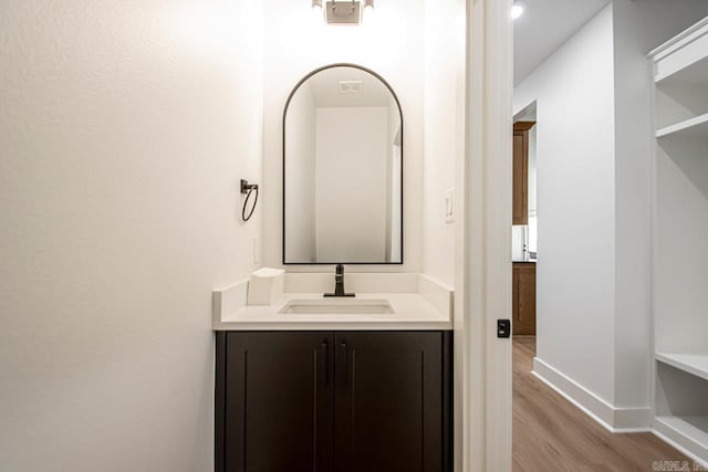 bathroom featuring vanity and hardwood / wood-style flooring