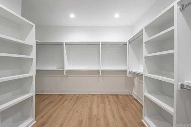 spacious closet featuring light wood-type flooring