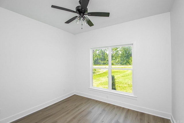 spare room with wood-type flooring and ceiling fan