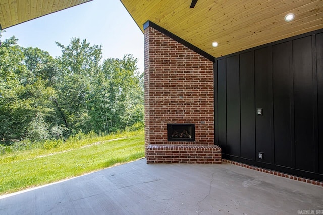 view of patio / terrace featuring an outdoor brick fireplace