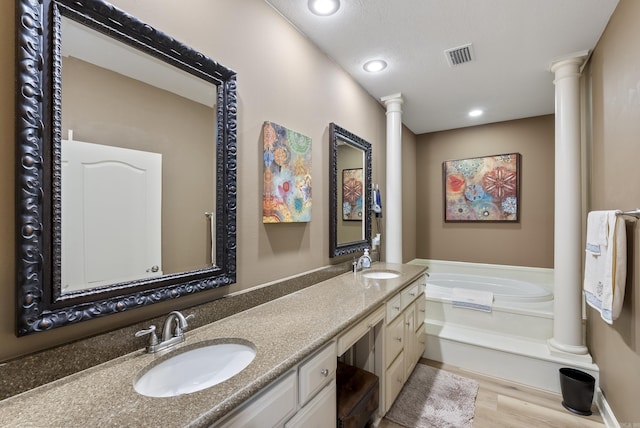 24 W Jericho Dr, Greenbrier, AR 72058 - full bathroom with visible vents, a sink, and decorative columns