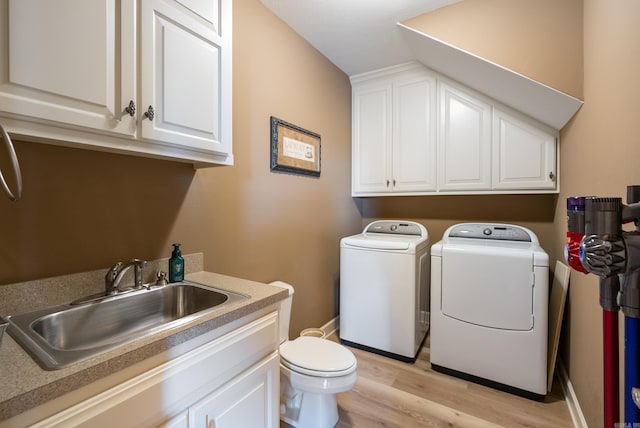 24 W Jericho Dr, Greenbrier, AR 72058 - clothes washing area featuring laundry area, light wood-style flooring, a sink, and independent washer and dryer