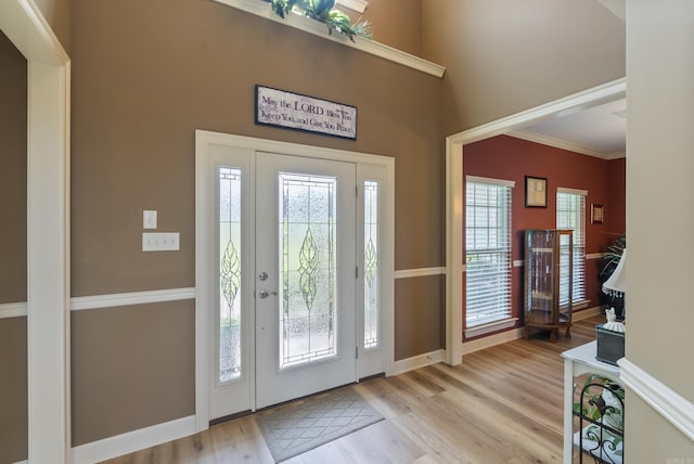 24 W Jericho Dr, Greenbrier, AR 72058 - entrance foyer with crown molding, a high ceiling, baseboards, and wood finished floors