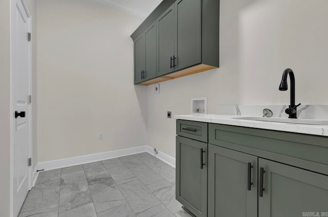 clothes washing area with crown molding, hookup for an electric dryer, sink, washer hookup, and cabinets