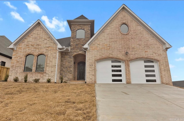 view of front facade with a garage and a front lawn