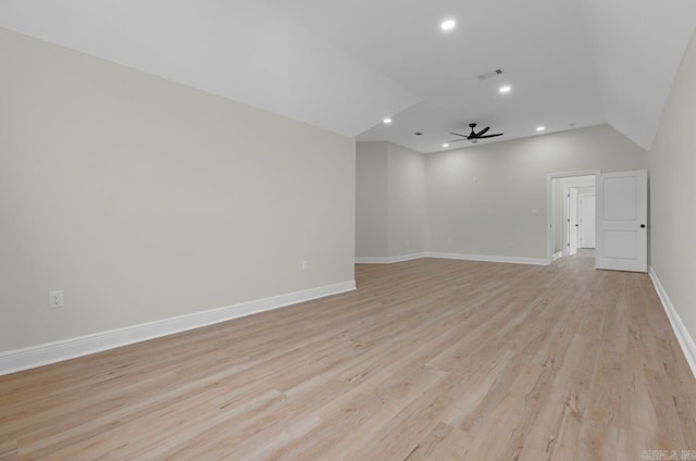 spare room featuring ceiling fan, vaulted ceiling, and light hardwood / wood-style floors