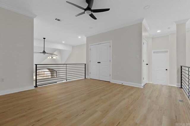 unfurnished living room with light wood-type flooring, crown molding, and ceiling fan