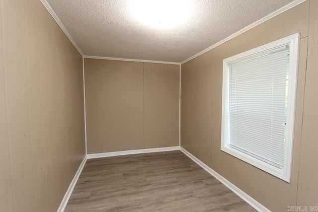 6 Fox Hill Rd, Greenbrier, AR 72058 - unfurnished room featuring baseboards, ornamental molding, a textured ceiling, and wood finished floors