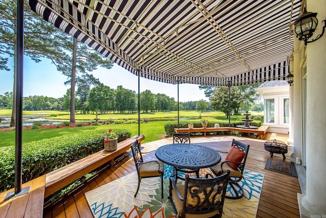 deck featuring a yard and outdoor dining area