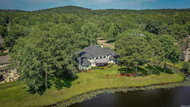 bird's eye view featuring a water view and a forest view