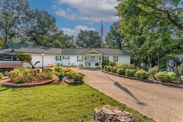 ranch-style home featuring a front yard