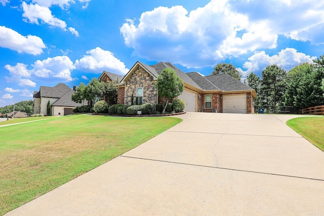 view of front of house with a garage and a front yard