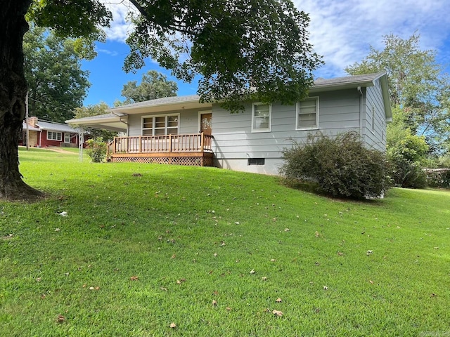 single story home featuring a wooden deck and a front lawn