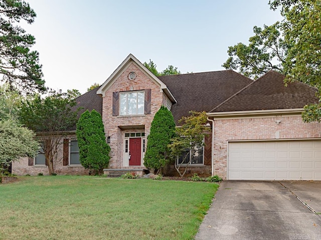 view of front of house featuring a garage and a front yard