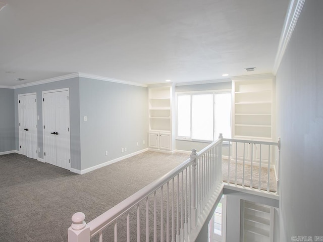 corridor featuring carpet and crown molding