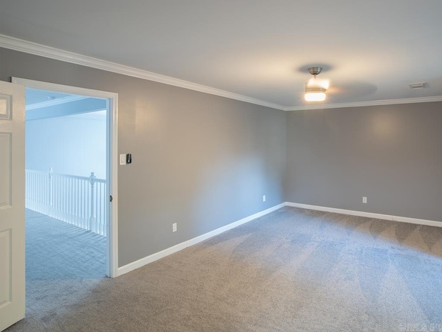 carpeted spare room with ornamental molding