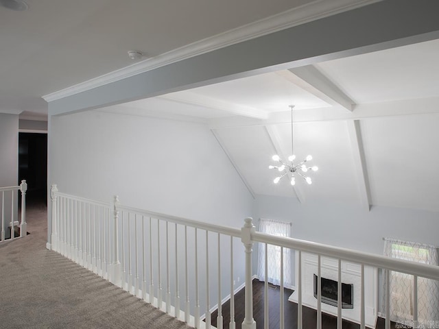 hallway with dark colored carpet, an inviting chandelier, and vaulted ceiling with beams