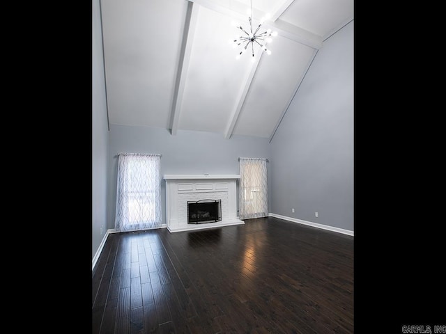 unfurnished living room featuring a fireplace, lofted ceiling with beams, a chandelier, and dark hardwood / wood-style floors