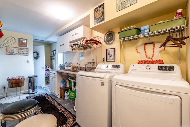 laundry area featuring independent washer and dryer and sink