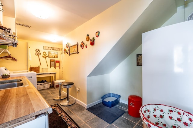 interior space with sink and tile patterned floors