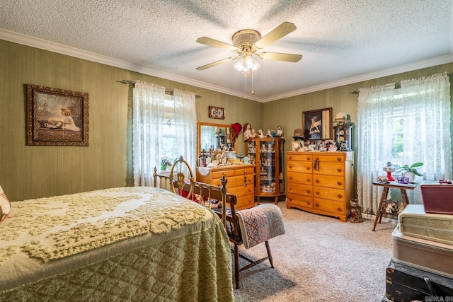 carpeted bedroom featuring crown molding, a textured ceiling, and ceiling fan