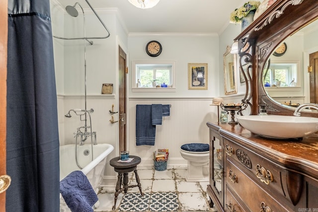 full bathroom with plenty of natural light, ornamental molding, and vanity