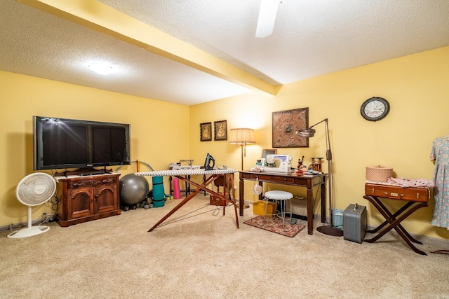 carpeted office with beamed ceiling and a textured ceiling