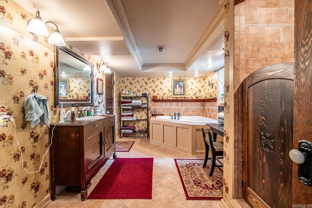 bathroom featuring crown molding, vanity, a raised ceiling, and a bath