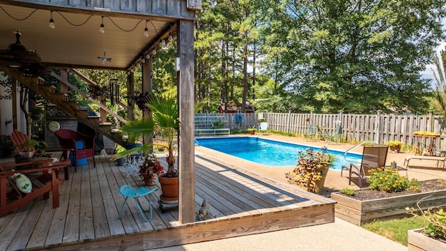 view of swimming pool featuring a deck