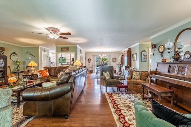 living room featuring crown molding, ceiling fan, and hardwood / wood-style flooring