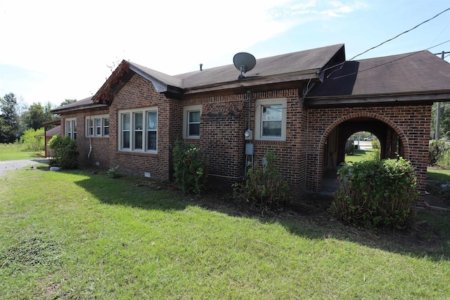 view of home's exterior featuring a lawn