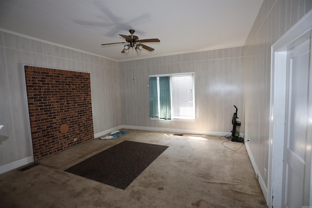 unfurnished room with ceiling fan, ornamental molding, and light carpet