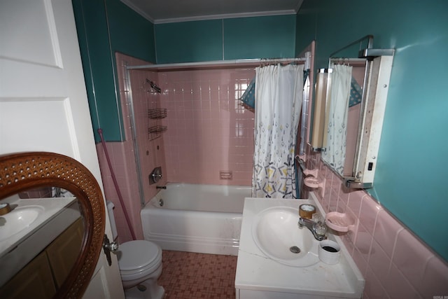 full bathroom with vanity, backsplash, tile walls, toilet, and shower / bath combo