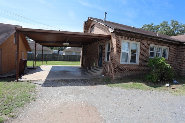 exterior space with a carport