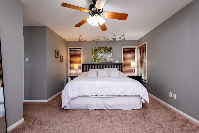 carpeted bedroom featuring ceiling fan