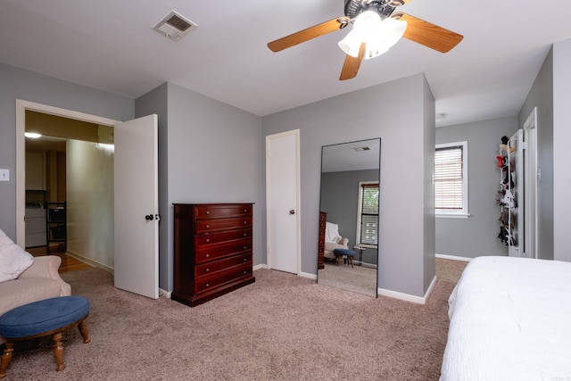 carpeted bedroom with ceiling fan