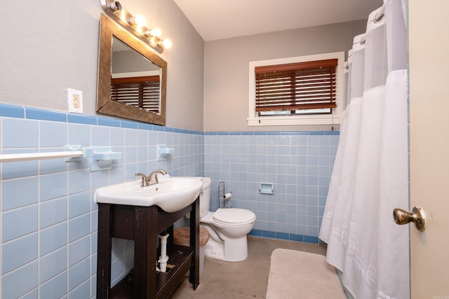 bathroom with tile patterned floors, toilet, tile walls, tasteful backsplash, and vanity