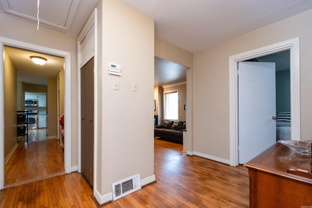 corridor featuring light wood-type flooring