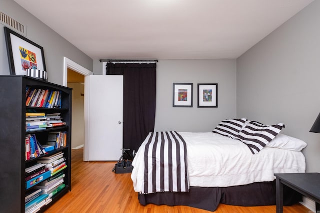 bedroom with light wood-type flooring