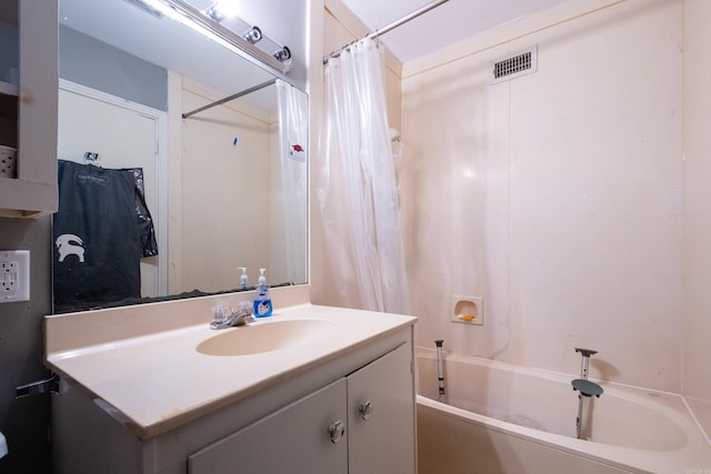 bathroom featuring vanity and shower / tub combo with curtain