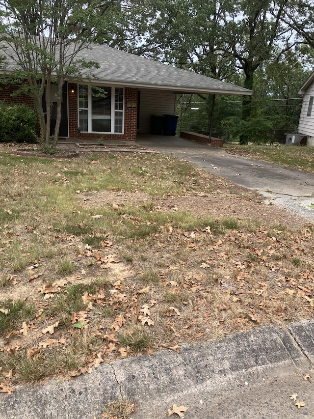 view of front of property with a carport