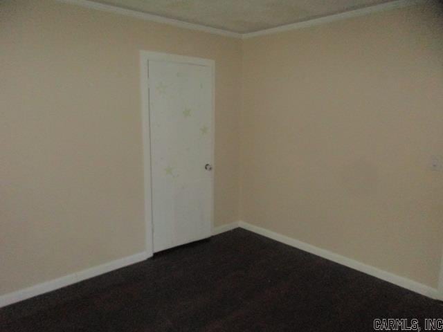 carpeted empty room with ornamental molding