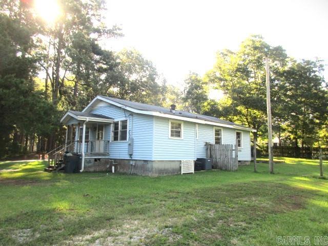 back of house with a yard