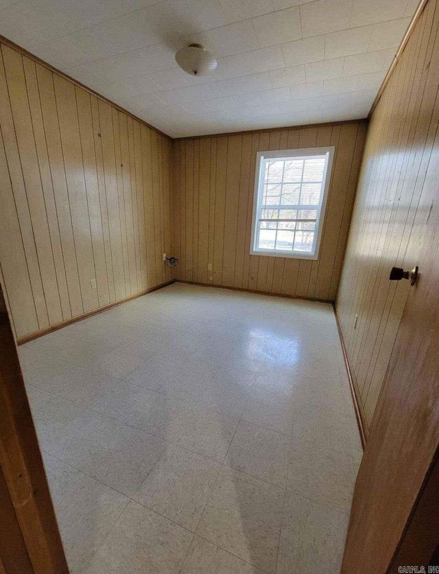 empty room with wooden walls
