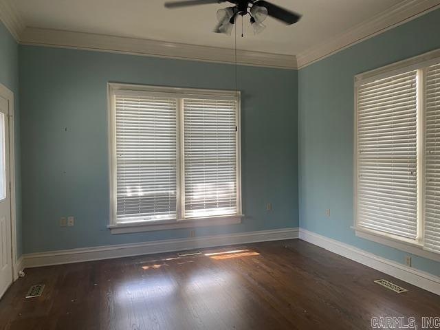 spare room featuring ceiling fan, dark hardwood / wood-style floors, and ornamental molding